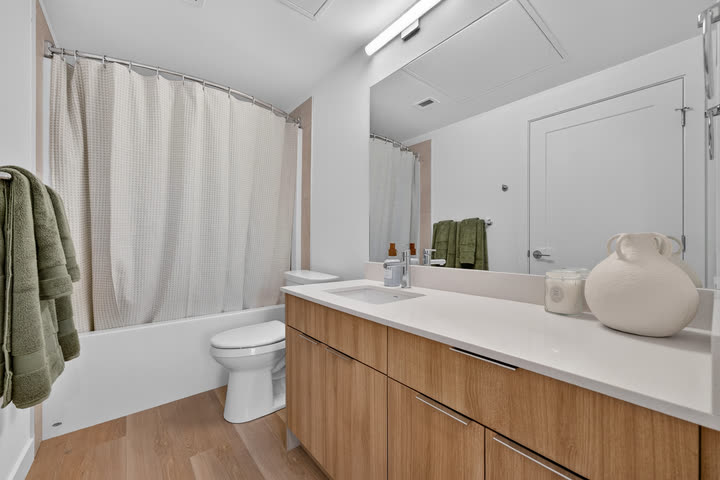 Ensuite bathroom with white oak vanity and quartz counter